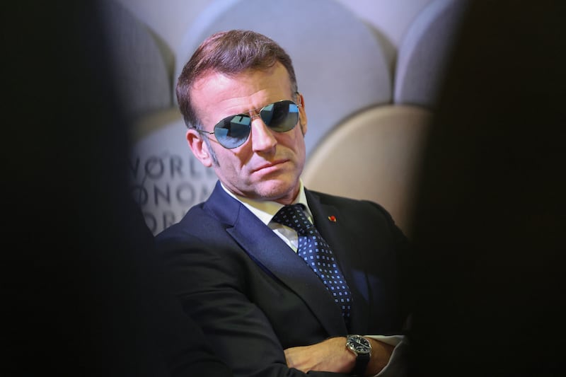 TOPSHOT - France's President Emmanuel Macron attends a meeting with CEOs of AI companies during the World Economic Forum (WEF) annual meeting in Davos on January 20, 2026. The World Economic Forum takes place in Davos from January 19 to January 23, 2026. (Photo by Ludovic MARIN / AFP via Getty Images)