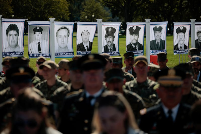 Photographs of victims who died in the September 11, 2001, attacks, are displayed at the Steel Across America event, which features a 21-foot steel beam recovered from the World Trade Centre South Tower, on the Ellipse near the White House in Washington, D.C., U.S., September 8, 2026. REUTERS/Evan Vucci