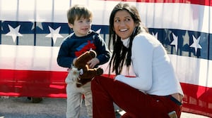 Katie Miller and her son at a Donald Trump campaign rally last year. She married the top Trump adviser Stephen Miller in 2020 with the president in attendance.