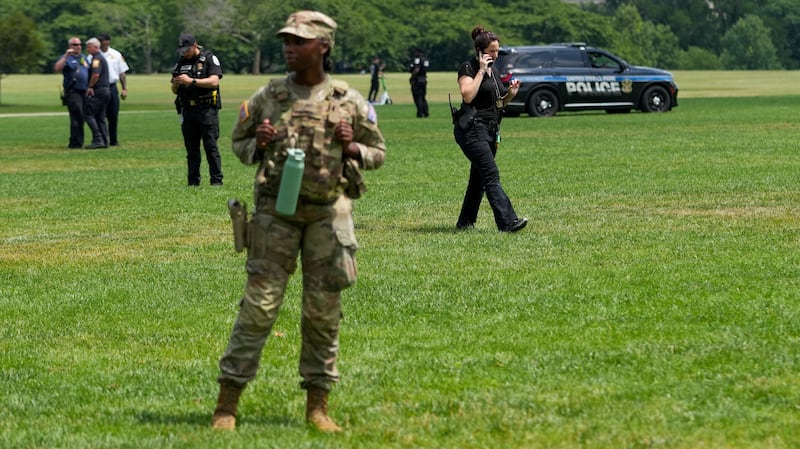 Authorities responded to what appeared to be a large tracing of the term 8647 into the grounds of the National Mall in Washington, D.C., U.S., June 11, 2026. A Reuters photographer captured the emerging image from atop the Washington Monument on the Mall's grass shortly before authorities arrived. The arrangement of the numbers was clearly an attempt to show 8647, though the 4 was not fully formed. Federal prosecutors on other occasions have said the term could indicate a threat to President Trump, the 47th U.S. president. REUTERS/ Nathan Howard