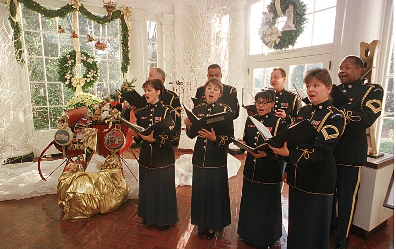 Members of the U.S. Army choir sing December 4, 2000 in the East Wing Landing.