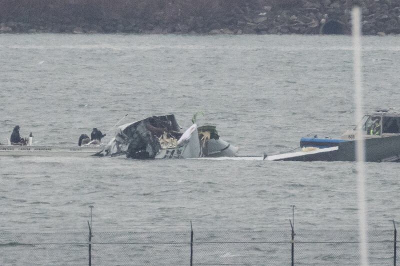 Search and rescue teams work near Ronald Reagan Washington National Airport in the aftermath of the collision of American Eagle flight 5342 and a U.S. Army Black Hawk helicopter that crashed into the Potomac River, outside Washington, U.S., January 31, 2025.