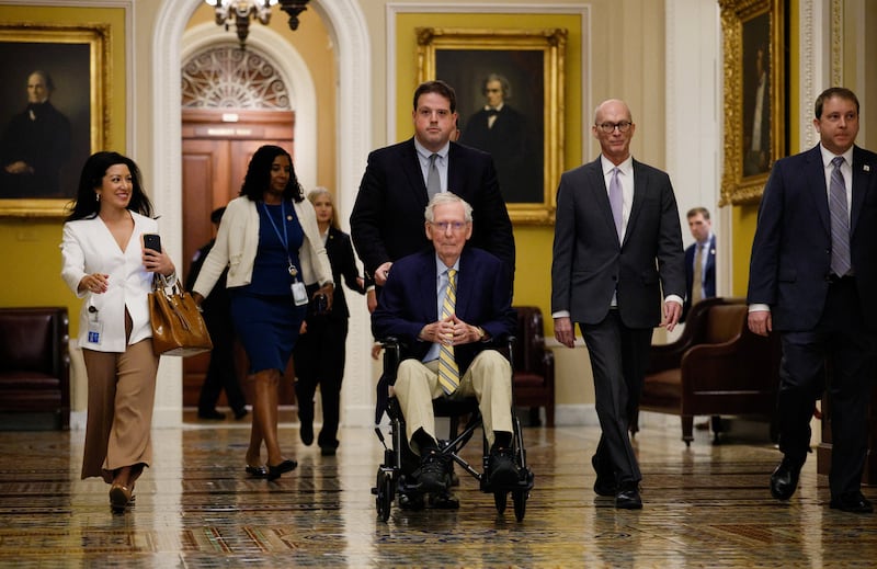 U.S. Senator Mitch McConnell (R-KY) sits in a wheelchair, as he is pushed on his way to speak to reporters outside the Senate Chamber after he returned to Capitol Hill in Washington, D.C., U.S., September 14, 2026.