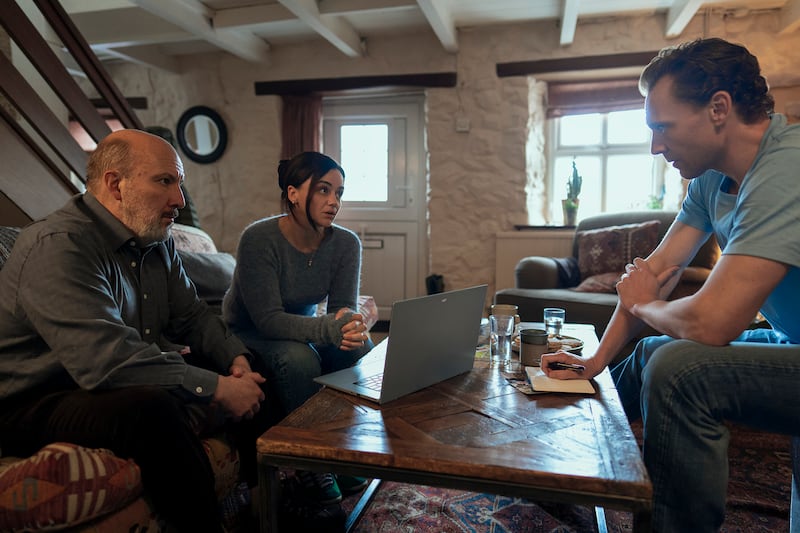 Hayley Squires as Sally, Paul Chahidi as Basil, and Tom Hiddleston as Jonathan Pine
