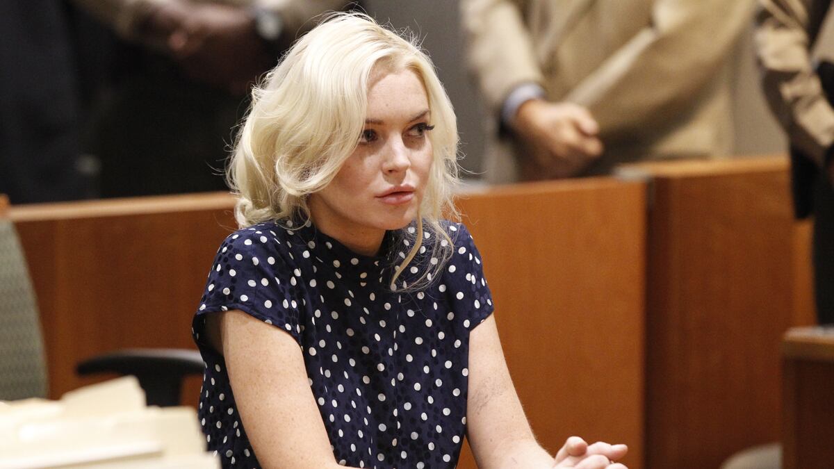 cheats/2011/11/07/lohan-spends-four-hours-in-jail/lohan-out-of-jail-cs_hovusx