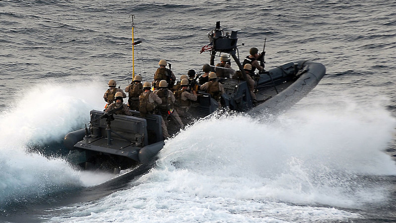 U.S. Marine Corps approach the Magellan Star during a boarding and seizure operation to retake the motor vehicle after it was attacked and boarded by pirates.