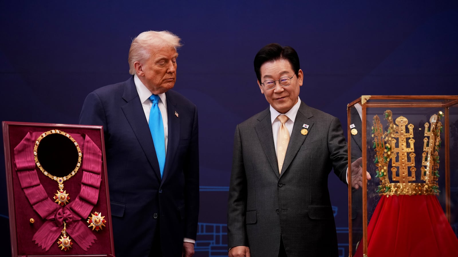 GYEONGJU, SOUTH KOREA - OCTOBER 29: U.S. President Donald Trump reacts as he is presented with the Grand Order of Mugunghwa and the Silla gold crown by South Korean President Lee Jae Myung at the Gyeongju National Museum on October 29, 2025 in Gyeongju, South Korea. Trump is in South Korea for the APEC meetings, following an appearance at the ASEAN summit in Malaysia, and a trip to Japan, where he called on Japanese Emperor Naruhito and new Prime Minister Sanae Takaichi. (Photo by Andrew Harnik/Getty Images)