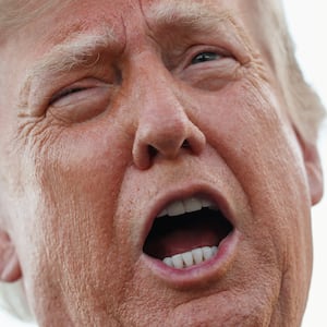U.S. President Donald Trump speaks to members of the press as he arrives at Charlotte Douglas International Airport, while he travels to attend a campaign rally supporting Republican U.S. Senate candidate Michael Whatley, in Charlotte, North Carolina, U.S., September 16, 2026.  REUTERS/Kevin Lamarque