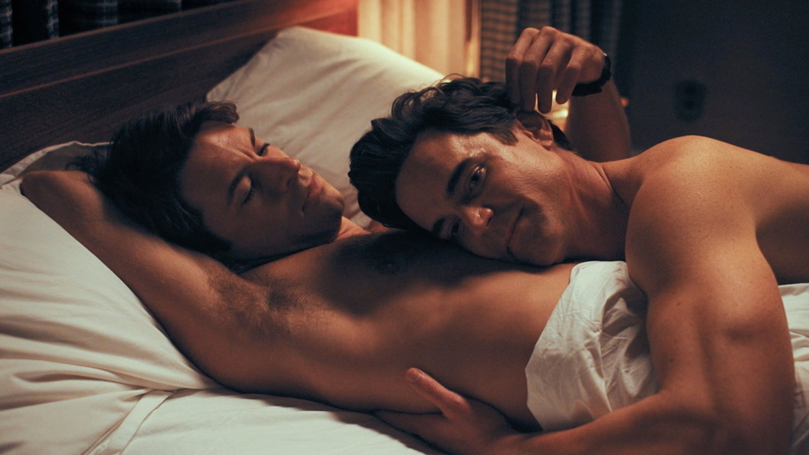 Jonathan Bailey and Matt Bomer in bed together in a still from ‘Fellow Travelers’