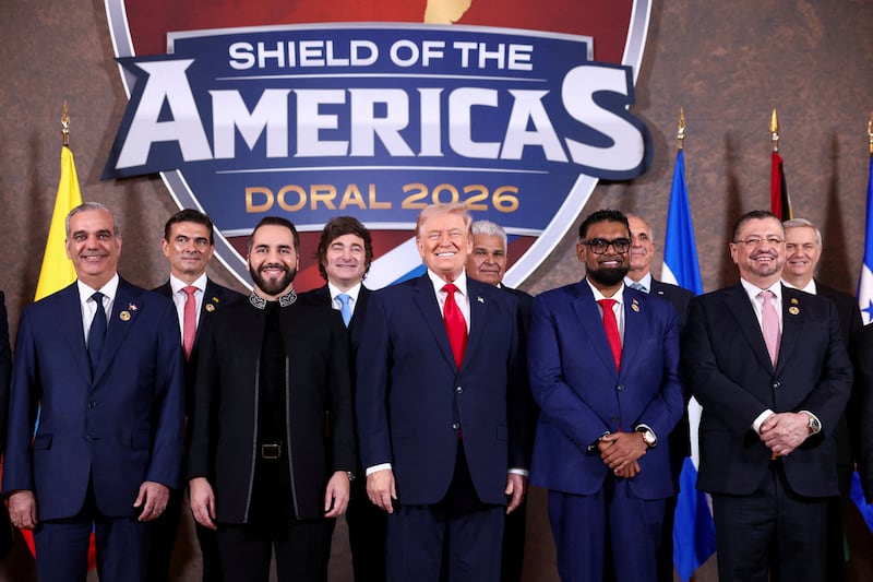 U.S. President Donald Trump, Dominican Republic President Luis Abinader, Argentina's President Javier Milei, El Salvador's President Nayib Bukele, Guyana's President Mohamed Irfaan Ali, Costa Rica's President Rodrigo Chaves Robles, Bolivia's President Rodrigo Paz and Chile's President-elect Jose Antonio Kast pose for a family photo during the "Shield of the Americas" Summit in Miami, Florida, U.S., March 7, 2026.