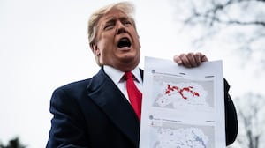 WASHINGTON, DC - MARCH 20 : President Donald J. Trump stops to speak to reporters and members of the media and to show a map of ISIS controlled territory as he walks to Marine One to depart from the South Lawn at the White House on Wednesday, March 20, 2019 in Washington, DC. (Photo by Jabin Botsford/The Washington Post via Getty Images)