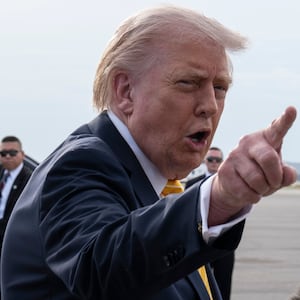 President Donald Trump speaks to journalists before boarding Air Force One at Palm Beach International Airport on May 2, 2026 in Palm Beach, Florida.