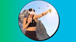 A woman in a meta 3 headset and black workout set punches a virtual target into a million pieces.