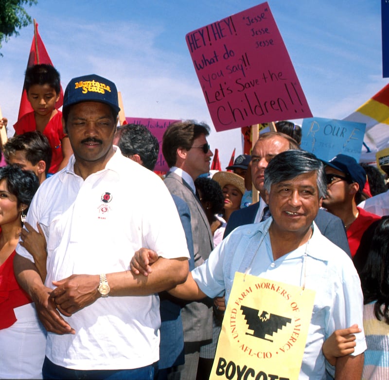 United Farm Workers President Cesar Chavez (right) joined Presidential candidate Jesse Jackson (left) in a support walk in McFarland, Calif. in file photo dated 6/4/88. (Photo by Bob Riha Jr/WireImage)