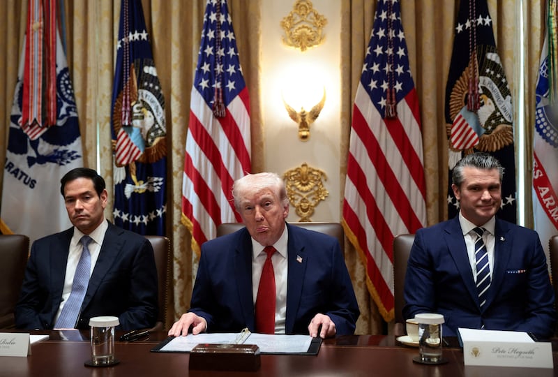 President Donald Trump, sitting next to Secretary of State Marco Rubio and Defense Secretary Pete Hegseth, holds a cabinet meeting at the White House in Washington, D.C., on March 26, 2026.