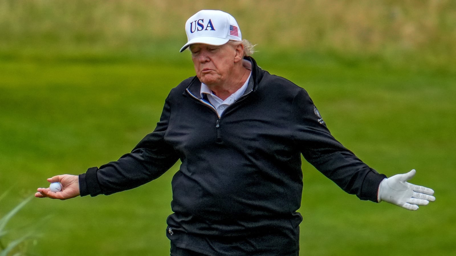 TURNBERRY, SCOTLAND - JULY 27: U.S. President Donald Trump reacts as he plays a round of golf at Trump Turnberry golf course during his visit to the UK on July 27, 2025 in Turnberry, Scotland. U.S. President Donald Trump is visiting his Trump Turnberry golf course, as well as Trump International Golf Links in Aberdeenshire, during a brief visit to Scotland from July 25 to 29. (Photo by Christopher Furlong/Getty Images)