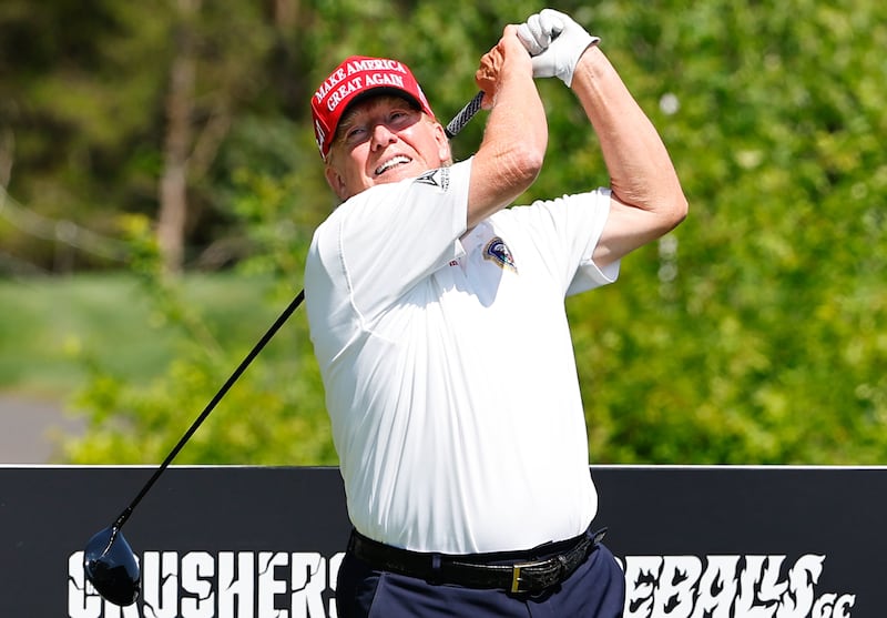 BEDMINSTER, NJ - AUGUST 09: Former President Donald Trump tees off at the 15th tee during a practice round at Trump National Golf Club on August 9, 2023 in Bedminster, New Jersey.