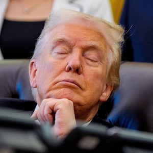 President Donald Trump with his eyes closed in the Oval Office at the White House on November 06, 2025 in Washington, DC.