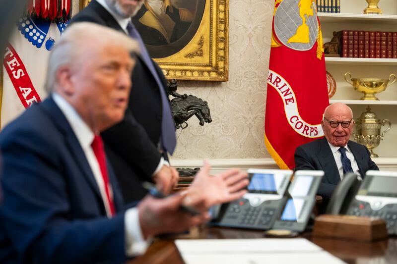 Media mogul Rupert Murdoch looks on as President Donald Trump speaks to members of the media as he signs proclamations, initiatives and appointments inside the Oval Office at the White House in Washington, DC on February 03, 2025. (Photo by Craig Hudson for The Washington Post via Getty Images)