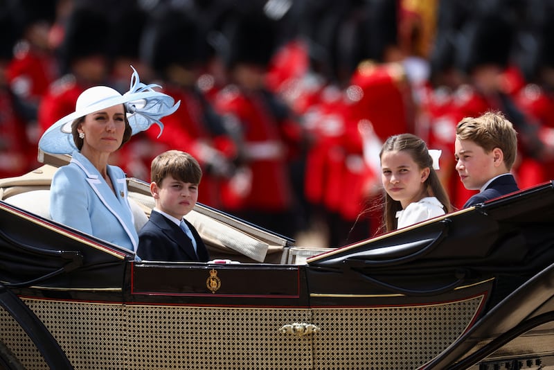 Britain's Kate, Princess of Wales, Prince George, Princess Charlotte, and Prince Louis ride in a carriage during the Trooping the Colour parade to honour Britain's King Charles, as part of the official birthday celebrations, in London, Britain, June 13, 2026. REUTERS/Toby Melville