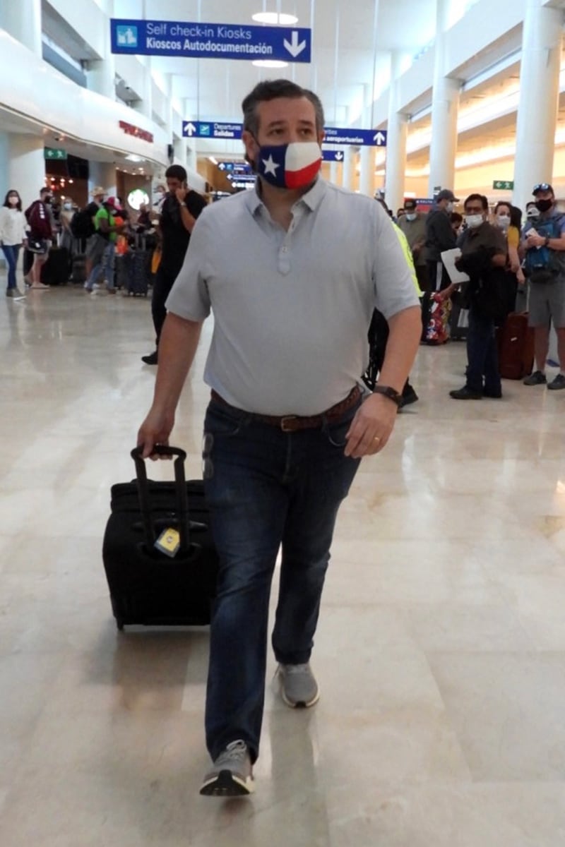 Ted Cruz checks in for a flight at Cancun International Airport after a backlash over his family vacation on Feb. 18, 2021.