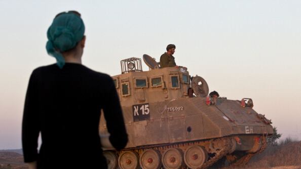 articles/2012/11/16/guns-generals-and-votes/israeli-tank-openz_wq0upu