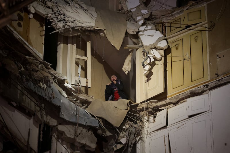 A woman trapped in a damaged building waits to be rescued following an Israeli strike, in Beirut, Lebanon, April 8.