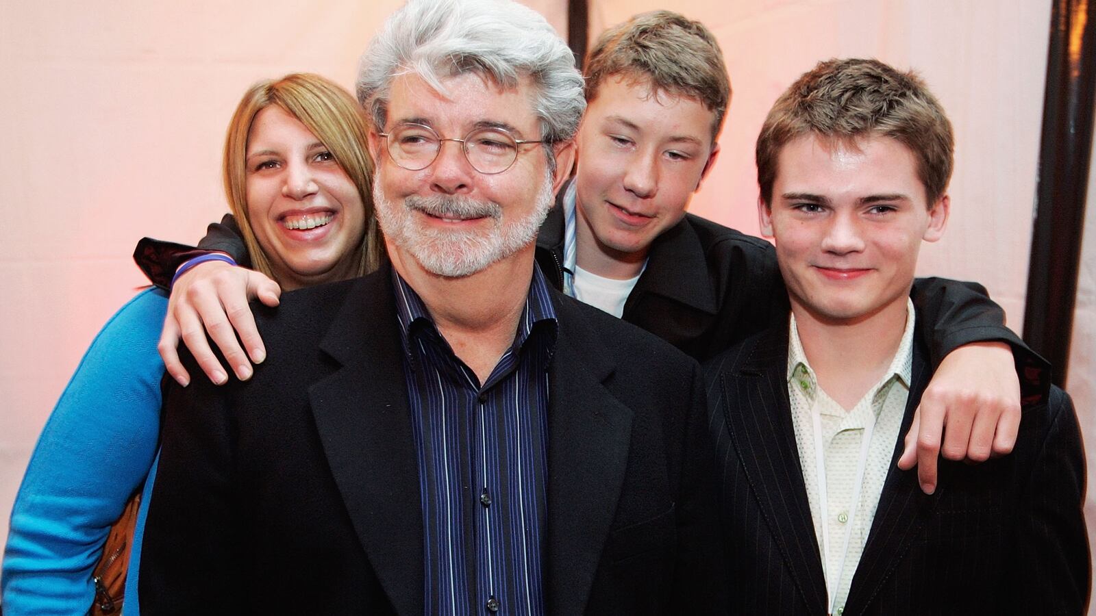 SAN FRANCISCO, CA- MAY 12: (L-R) George Lucas director of Star Wars, Amanda Lucas, Jett Lucas and Jake Lloyd attend the after party of the San Francisco World Premiere of Star Wars: Episode III Revenge of the Sith at the Loews Theaters Metreon on May 12, 2005 in San Francisco, California. The Premiere was a benefit for the Koret Family House, which provides temporary housing for families of children with cancer and other serious illnesses while being treated at UCSF Children's Hospitial. (Photo by David Paul Morris/Getty Images)
