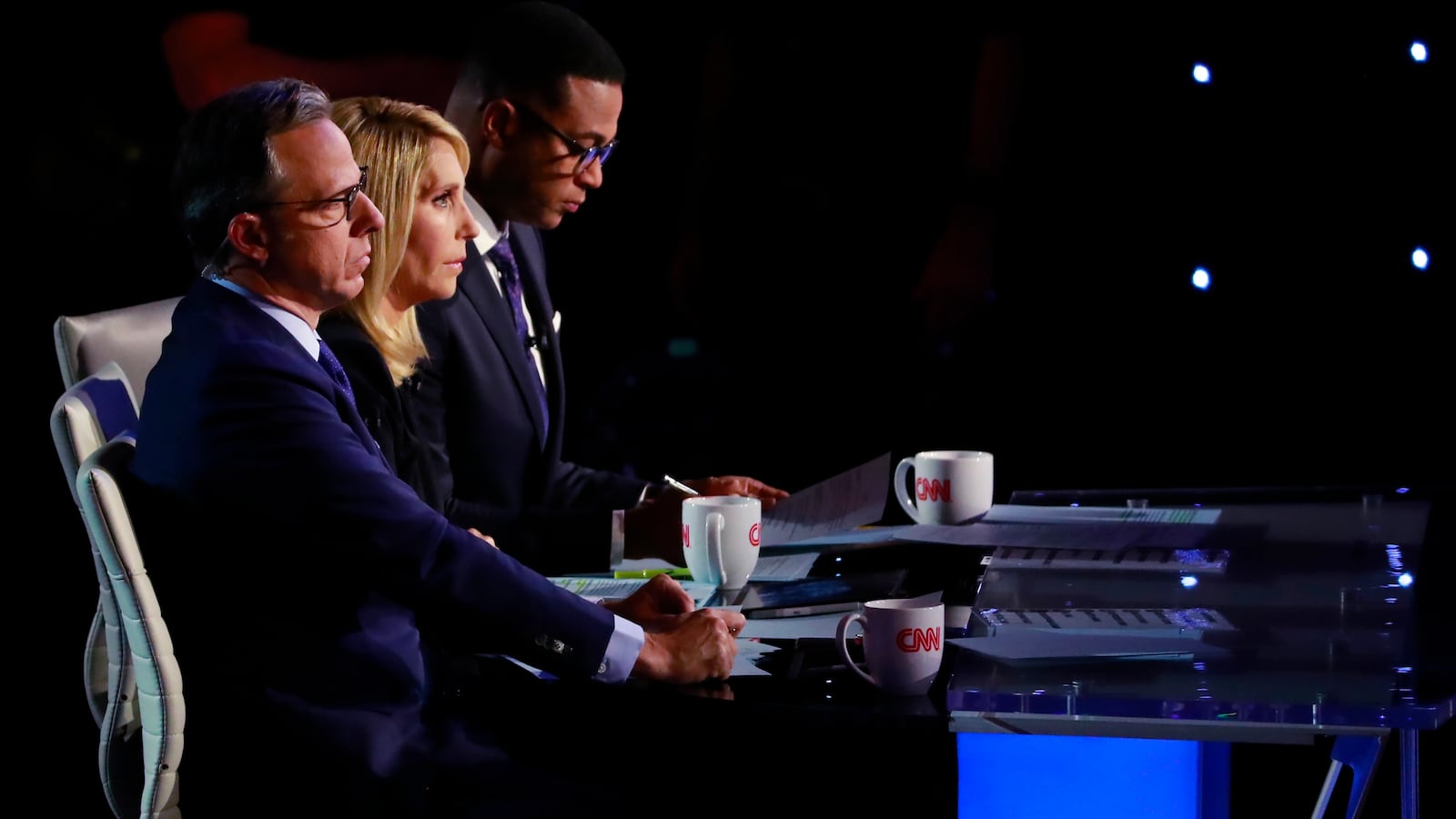 Jake Tapper, Dana Bash, and Don Lemon sit at a desk.