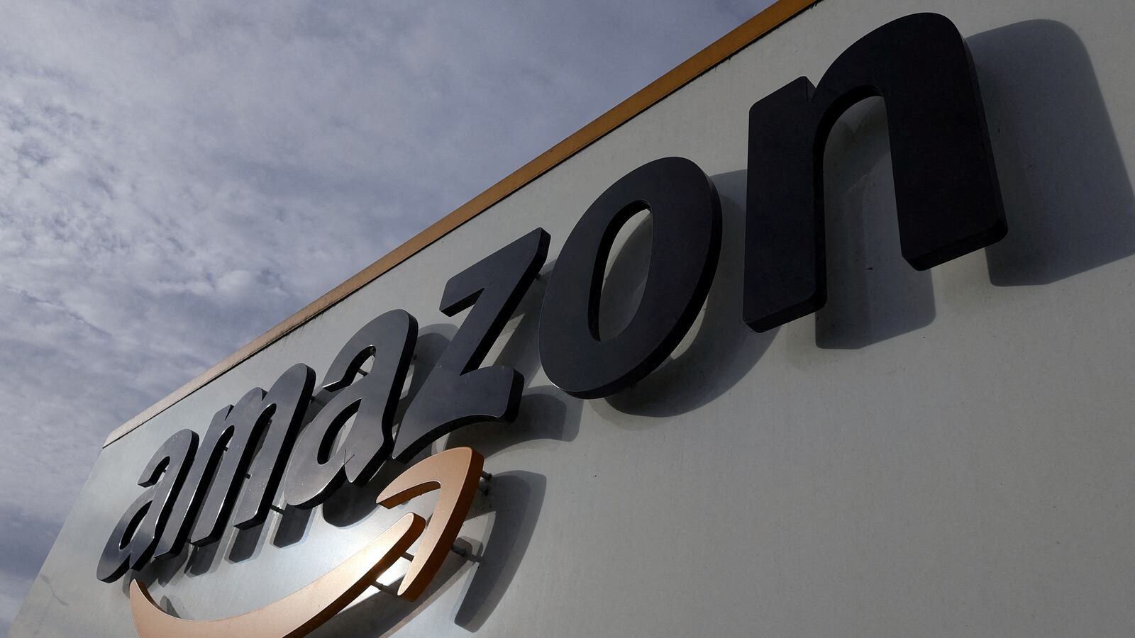 The logo of Amazon is seen at the company logistics center in Lauwin-Planque, northern France