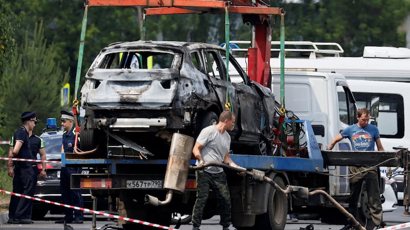 A crane lifts a wrecked car at the scene of a car explosion, which killed the driver, in the city of Balashikha in the Moscow region, Russia, June 9, 2026.
