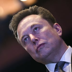 Elon Musk looks on as US President Donald Trump speaks at the US-Saudi Investment Forum at the John F. Kennedy Center for the Performing Arts in Washington, DC on November 19, 2025. (Photo by Brendan SMIALOWSKI / AFP) (Photo by BRENDAN SMIALOWSKI/AFP via Getty Images)