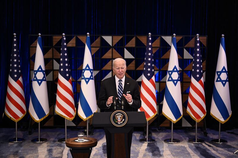 A photo including US President Joe Biden holding a Press Conference