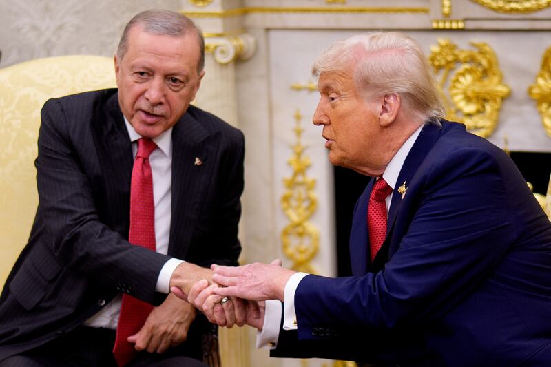 U.S. President Donald Trump (R) shakes hands with President of Turkey Recep Tayyip Erdogan