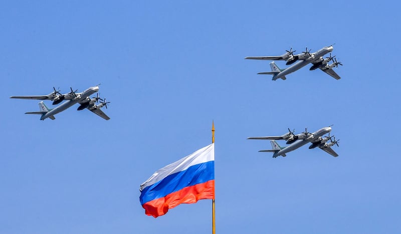 Russian Tupolev Tu-95 turboprop-powered strategic bombers fly above the Kremlin during a rehearsal for the Victory Day military parade in Moscow on May 4, 2018. -
