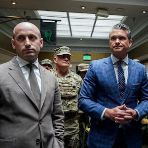 WASHINGTON, DC - AUGUST 20: (L-R) White House Deputy Chief of Staff Stephen Miller, Defense Secretary Pete Hegseth, and Vice President JD Vance speak with members of the National Guard during a visit to Union Station on August 20, 2025 in Washington, D.C. The Trump administration has deployed federal officers and the National Guard to the District in order to place the DC Metropolitan Police Department under federal control and assist in crime prevention in the nation's capital.