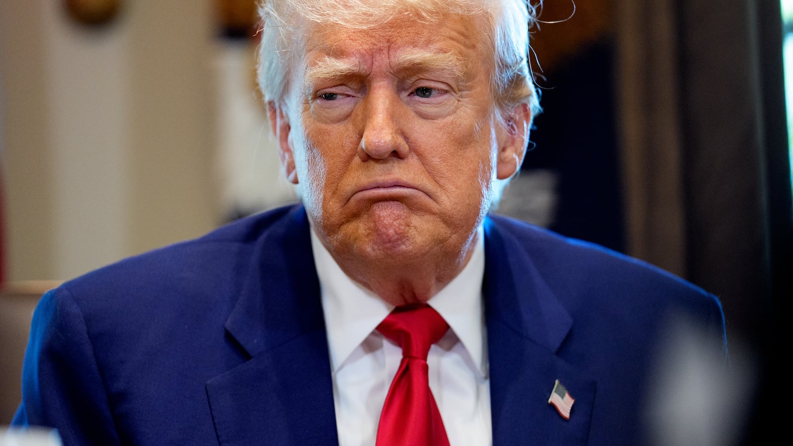 Donald Trump reacts to a question during a Cabinet meeting.