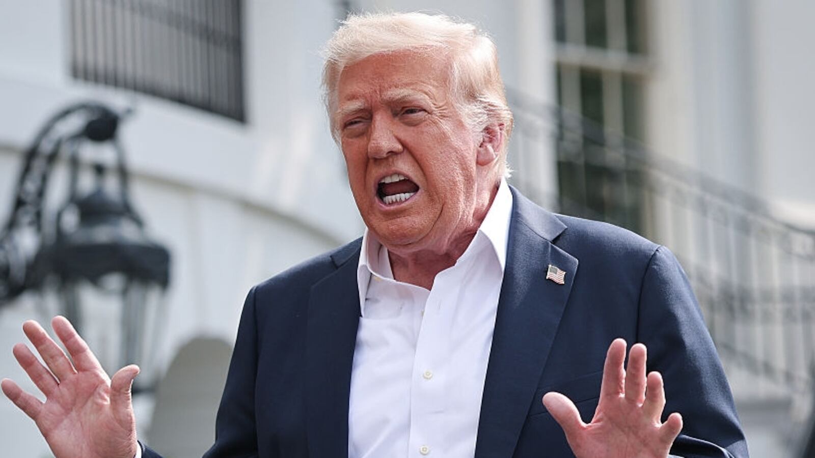 WASHINGTON, DC - JULY 11: U.S. President Donald Trump answers questions while departing the White House on July 11, 2025 in Washington, DC. Trump is scheduled to travel to Central Texas today to meet with first responders and local elected officials involved with the recovery process from last week's flash flooding event that has claimed more than 120 lives. (Photo by Win McNamee/Getty Images)