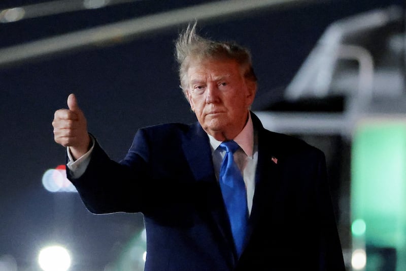 President Donald Trump gestures while walking at the John F. Kennedy International Airport, following Trump's attendance of the 81st United Nations General Assembly (UNGA), in New York City, US, September 22, 2026.