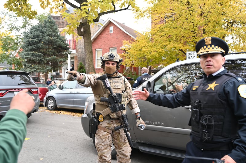 U.S. Immigration and Customs Enforcement (ICE) agents conduct operations in the Little Village neighborhood, a predominantly Mexican-American community, on November 8, 2025 in Chicago, Illinois.