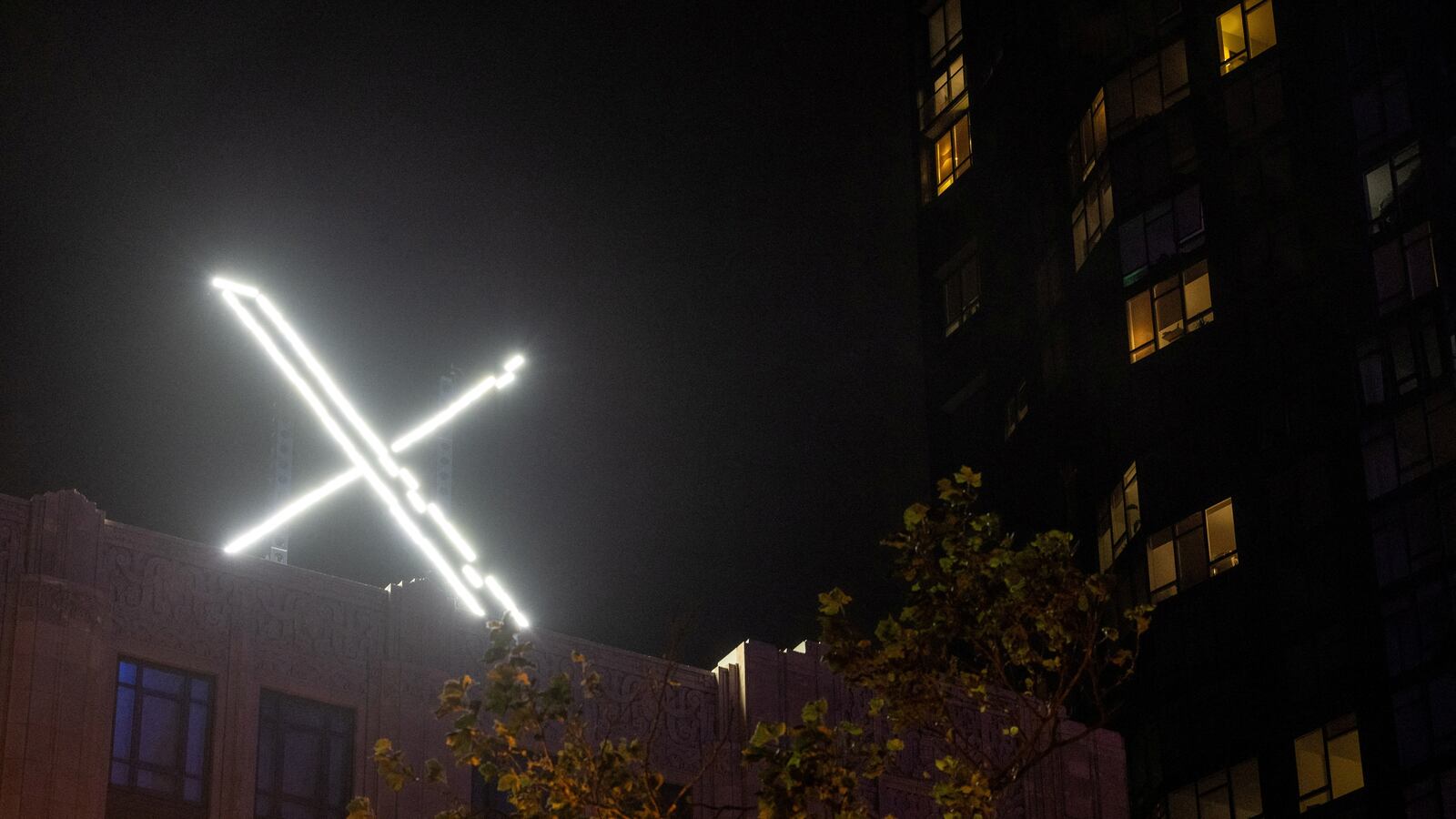 ‘X’ logo is seen on the top of the headquarters of the messaging platform X, formerly known as Twitter, in downtown San Francisco.