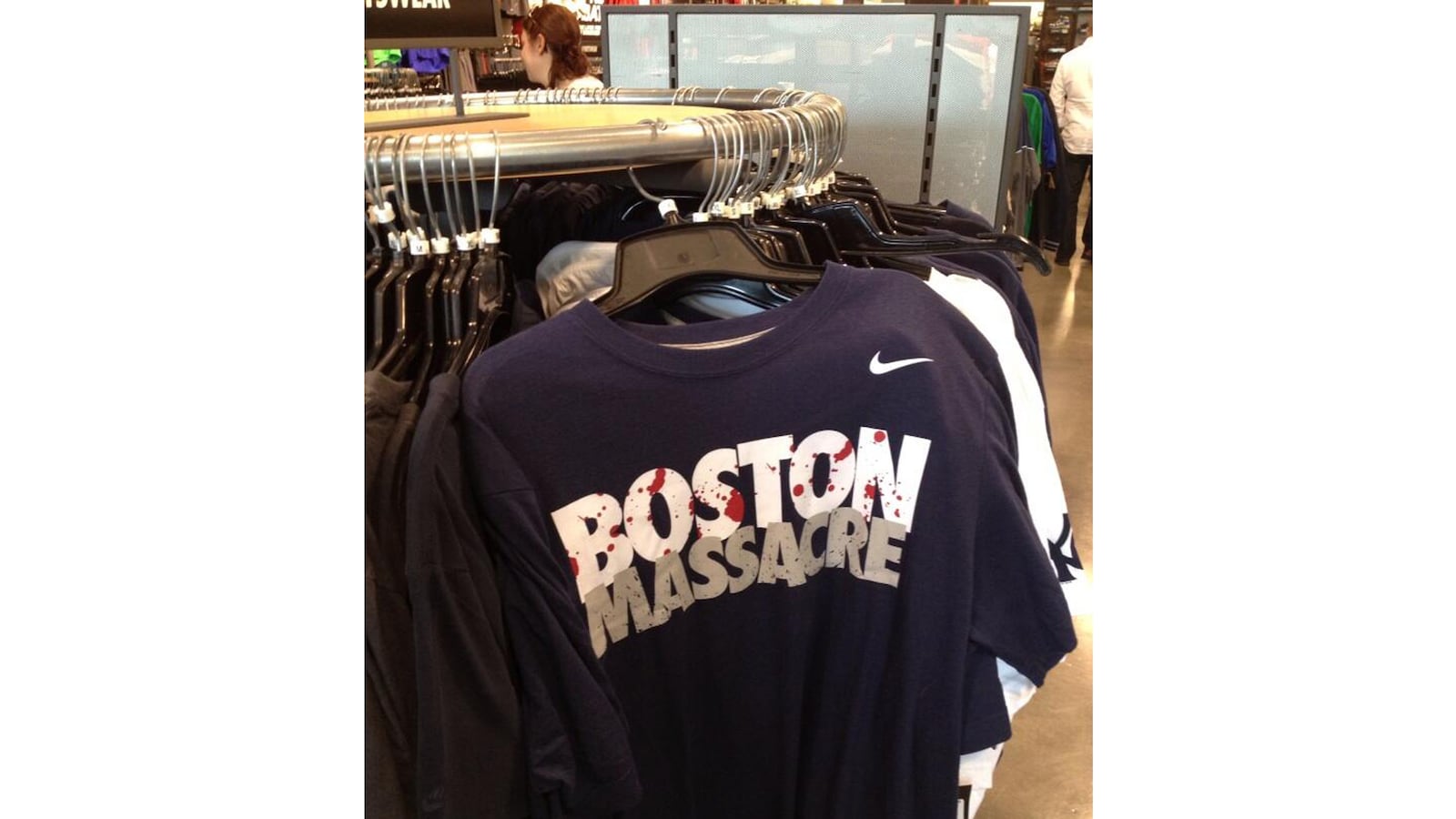 articles/2013/04/22/nike-reportedly-scrambling-to-remove-boston-massacre-shirts-from-shelves/130422-nike-boston-offensive-shirt-tease_ox5xfv