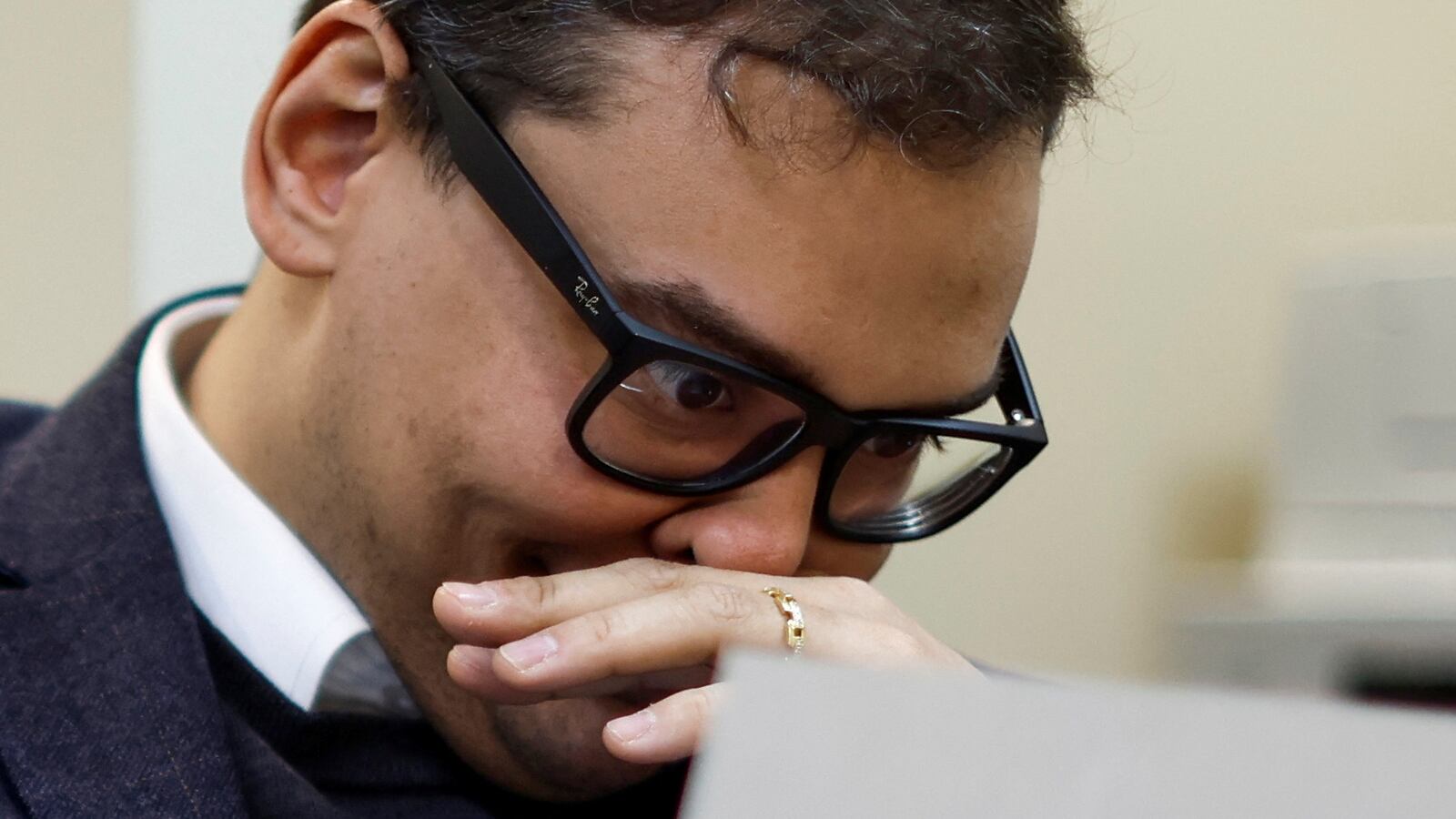 U.S. Representative George Santos (R-NY) reacts as he reads hate mail at his district office in Douglaston, New York, U.S. February 22, 2023.