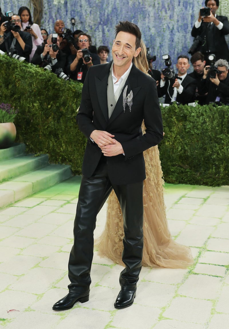Adrien Brody and Georgina Chapman pose during the Met Gala, an annual fundraising gala held for the benefit of the Metropolitan Museum of Art's Costume Institute with this year's theme 'Costume Art' in New York City, New York, U.S., May 4, 2026. REUTERS/Daniel Cole