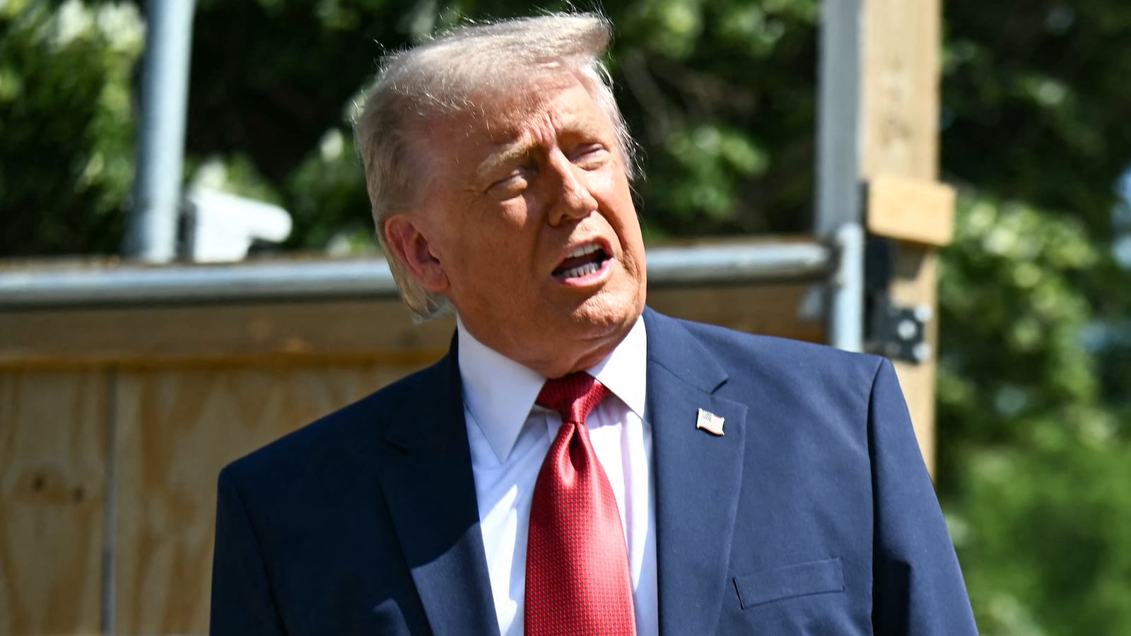 President Donald Trump speaks to the press near the construction site of his proposed ballroom at the White House in Washington, DC, on May 19, 2026.