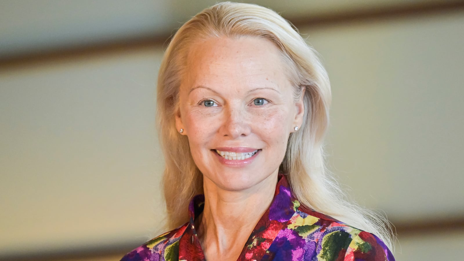 Pamela Anderson smiles.