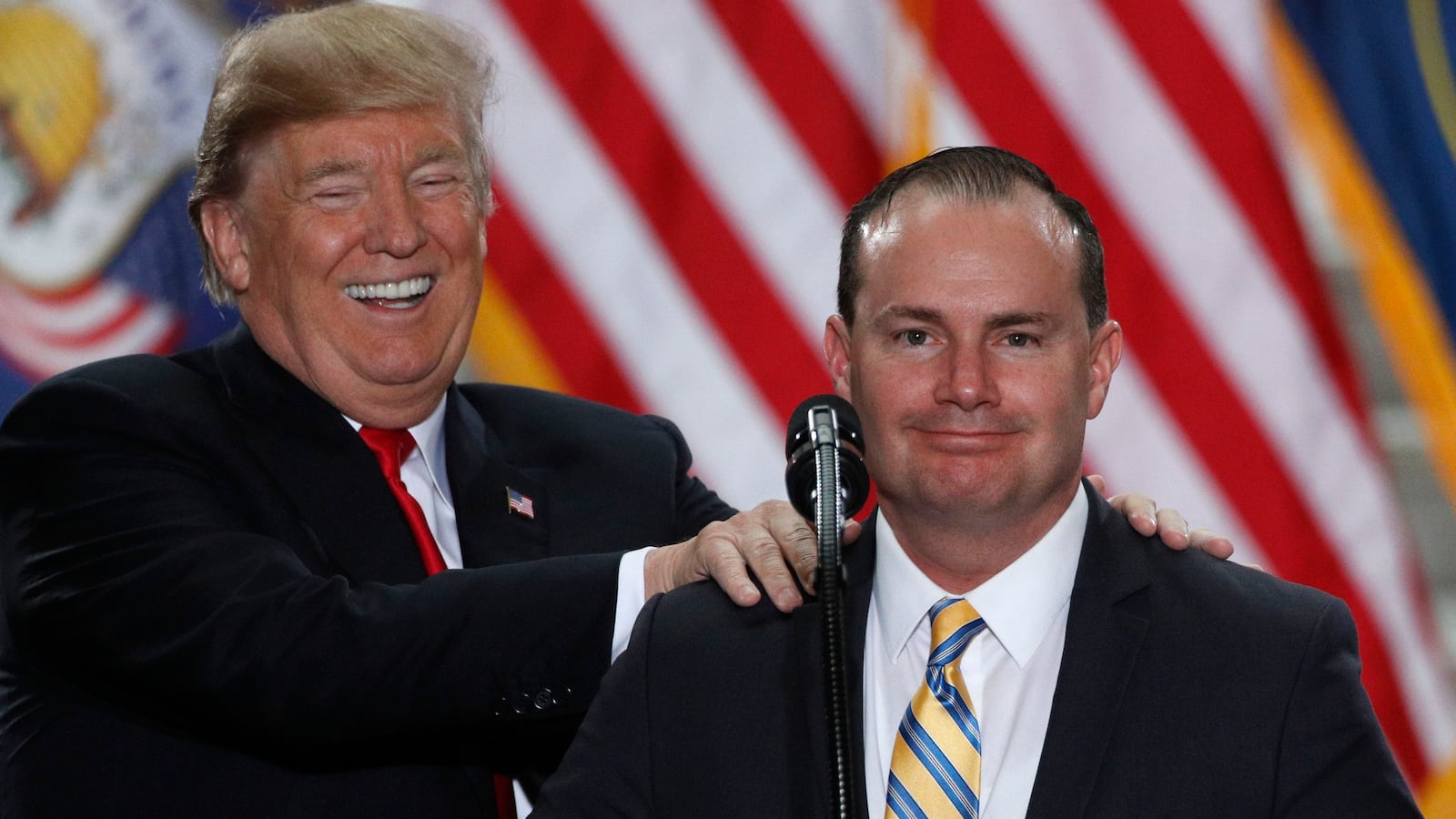 U.S. President Donald Trump jokes with Senator Mike Lee.