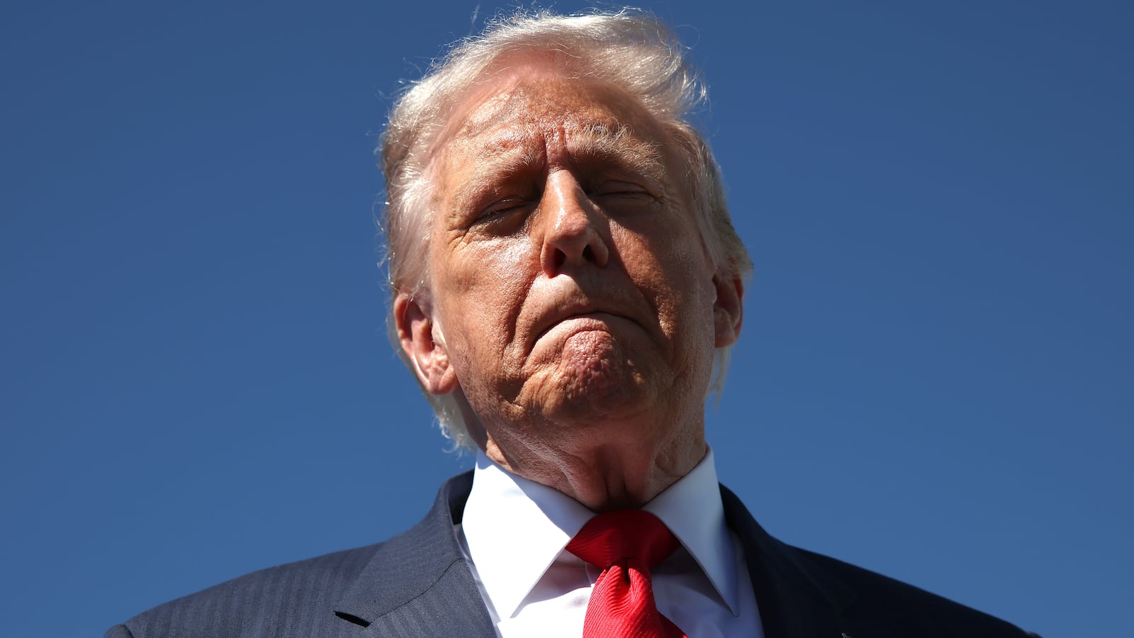 WEST PALM BEACH, FLORIDA - OCTOBER 31: US President Donald Trump speaks to reporters as he arrives at Palm Beach International Airport on October 31, 2025 in West Palm Beach, Florida. Trump is spending the weekend at his Mar-A-Lago estate in Palm Beach, Florida. (Photo by Samuel Corum/Getty Images)