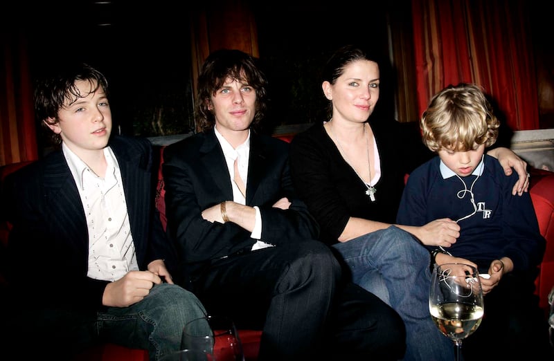 Musician Jackson Scott, designer Sadie Frost and her children Finlay Kemp (L) and Rafferty Law (R) attend a reception prior to the Celebrity Screening for film "Meet The Fockers" at the Covent Garden Hotel on January 24, 2005 in London. The film is the sequel to 2000's hit comedy "Meet The Parents" and stars Blythe Danner, Robert De Niro, Barbra Streisand and Ben Stiller.
