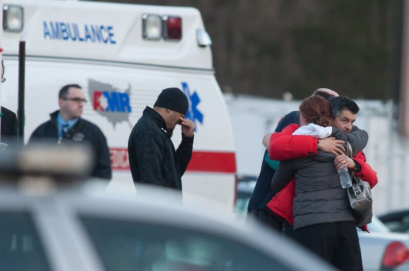 Distraught people outside firehouse near Sandy Hook Elementary School